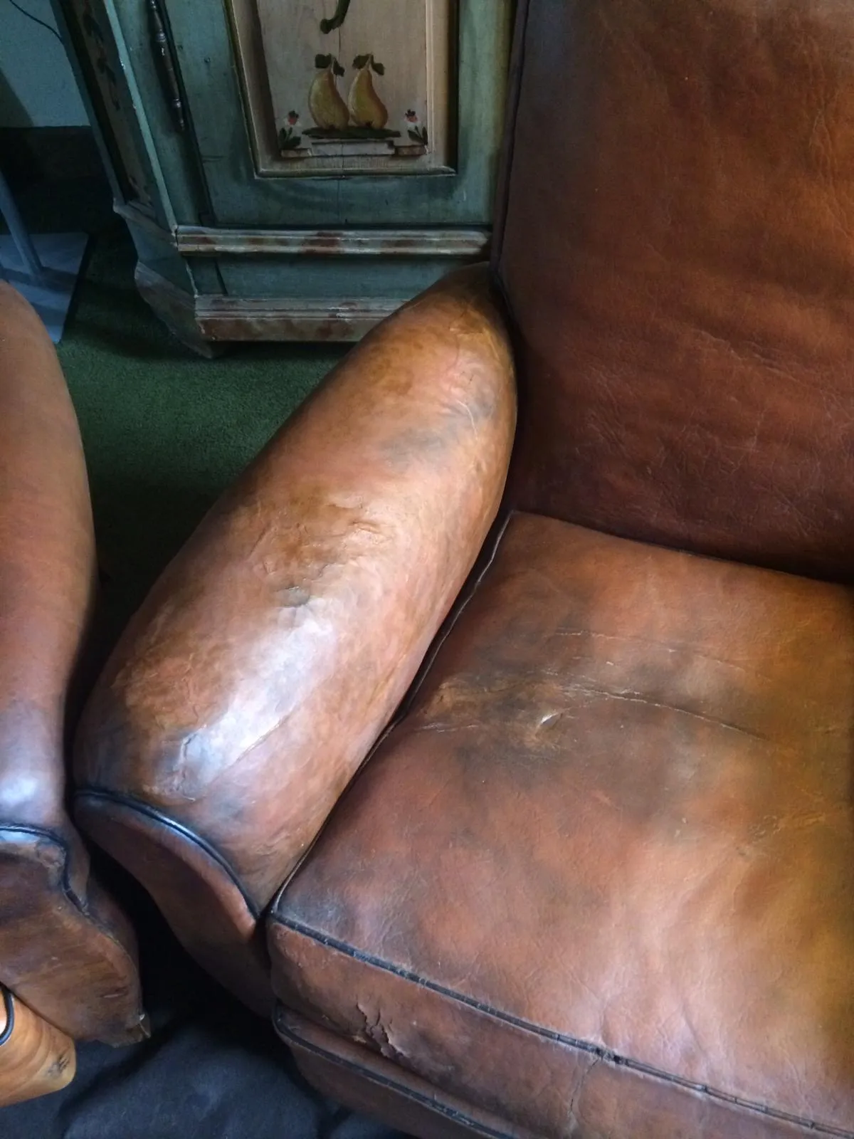 Colour-patching being applied to blend restored arm panels with the original leather